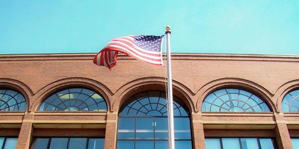 american flag in from of the Camden Campus